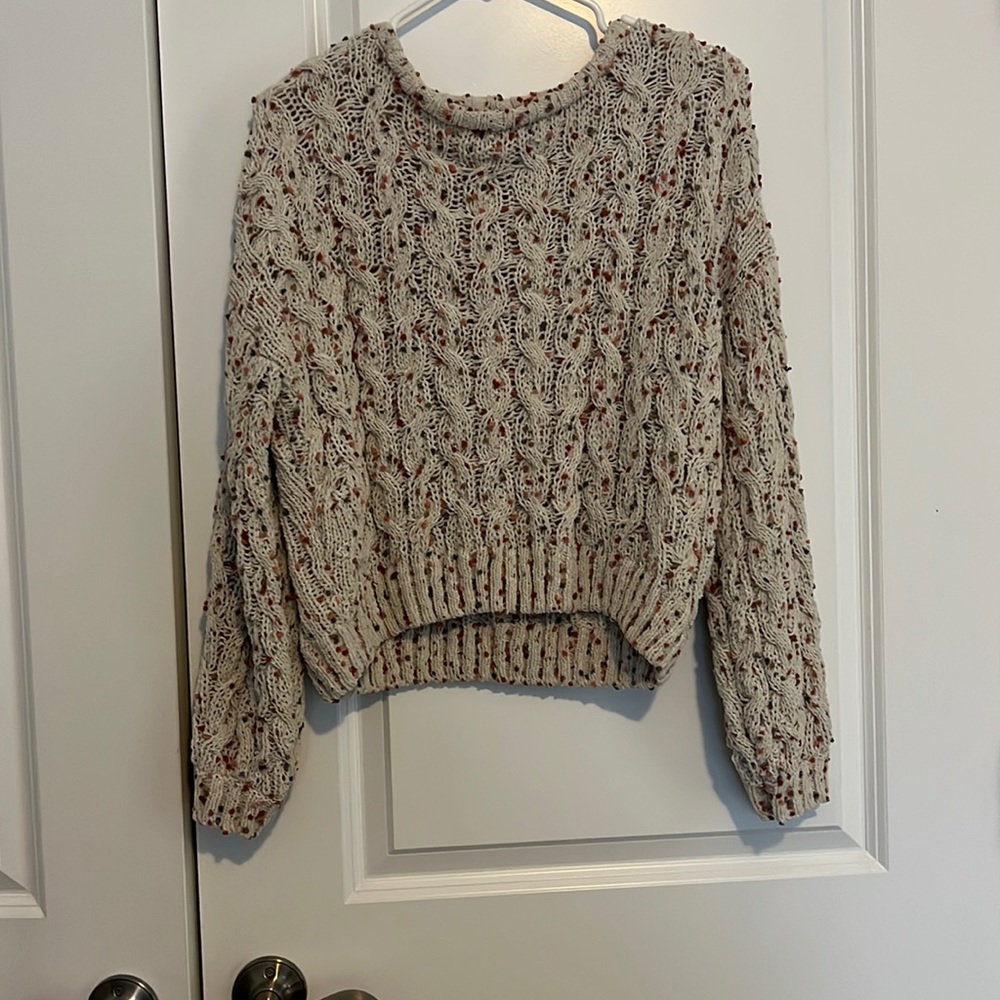 Light weight sweater. See through but barely. Runs smaller but cropped feeling